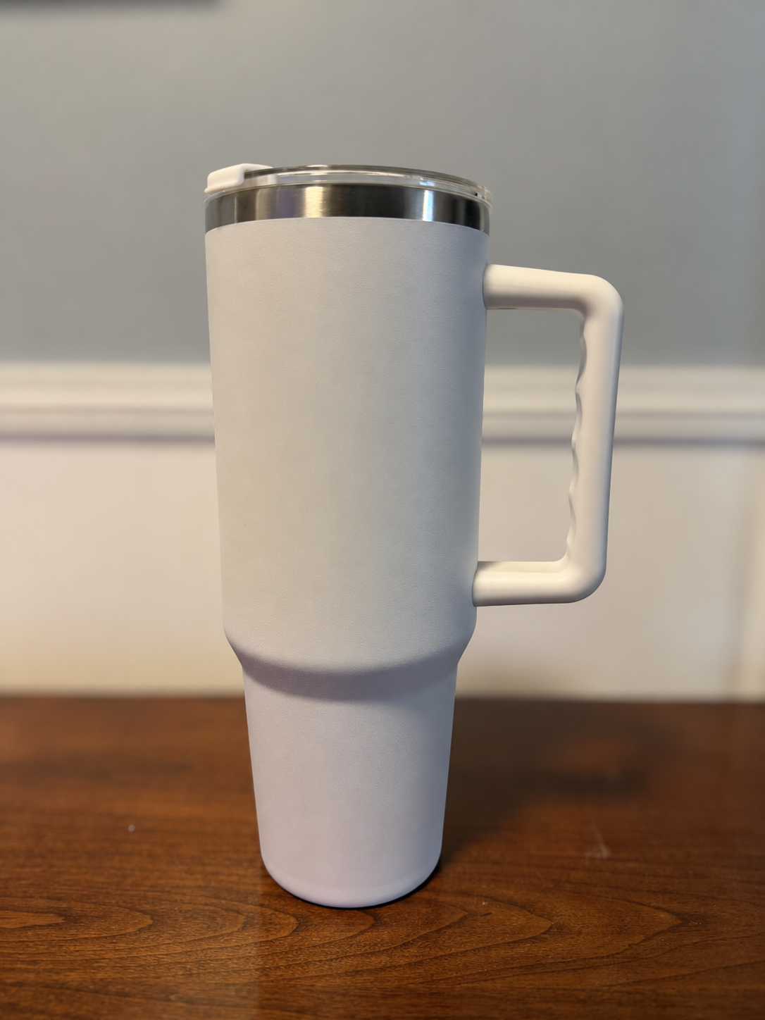 White 40-ounce handled tumbler available for a custom order