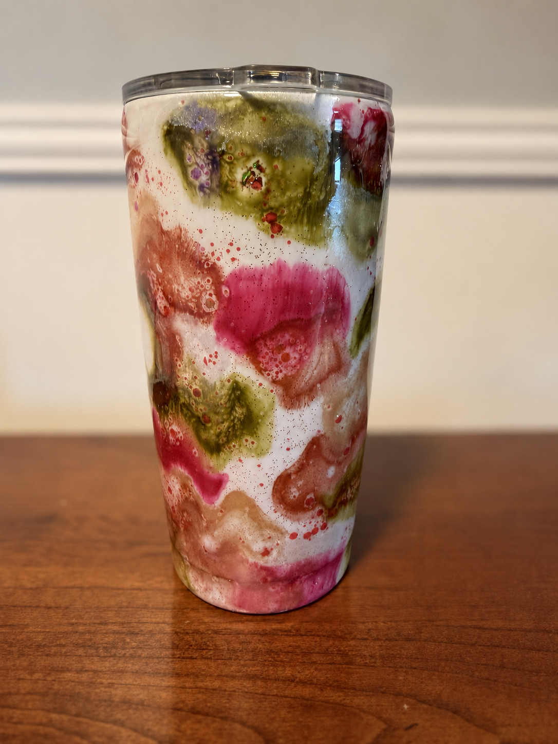 Finished pink, olive green, cream, and copper epoxy tumbler, front view